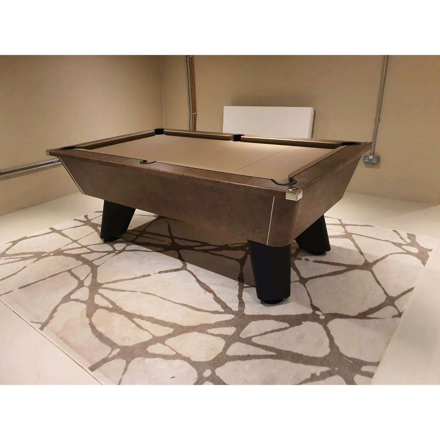 Pool table in a room with a stone-patterned floor
