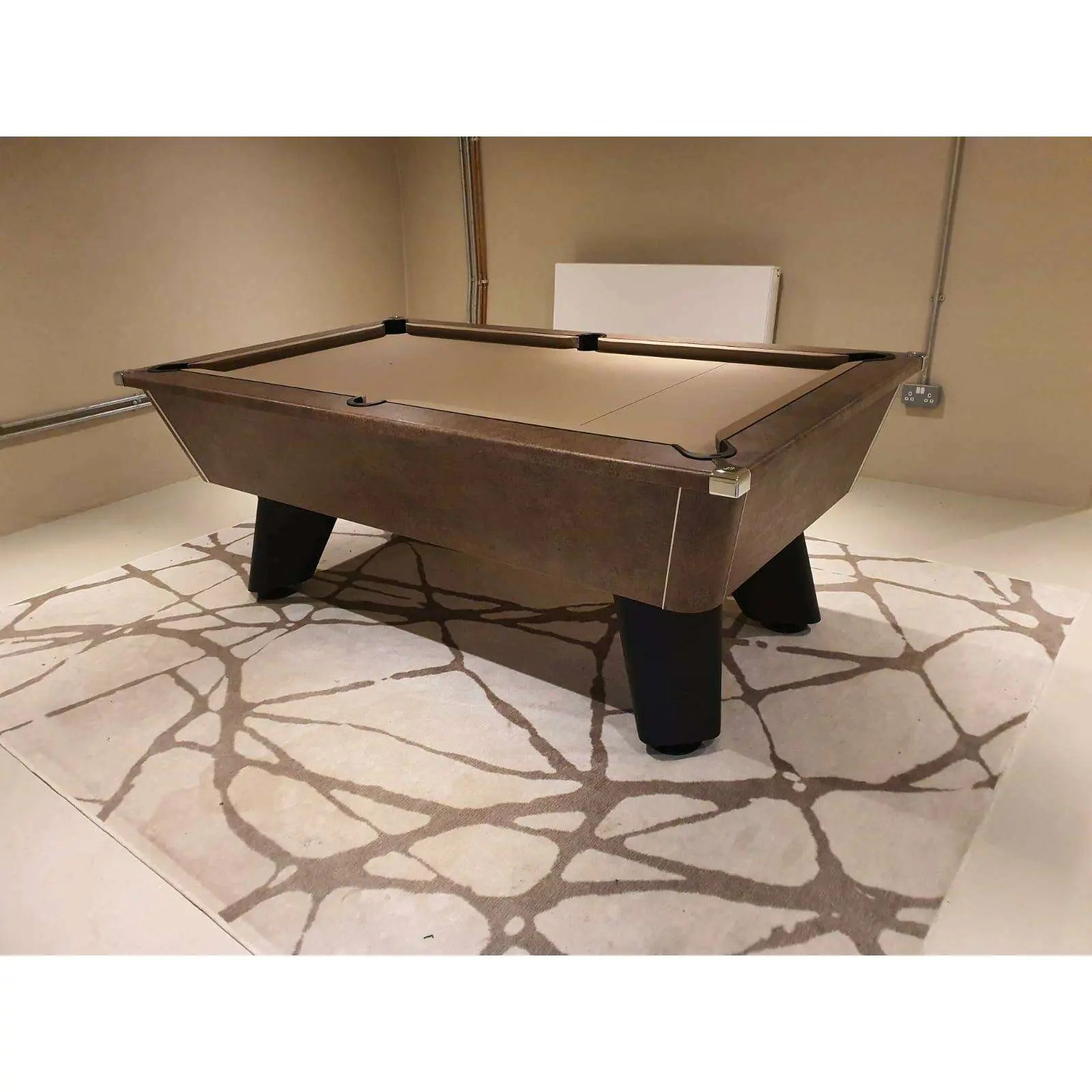Pool table in a room with a stone-patterned floor