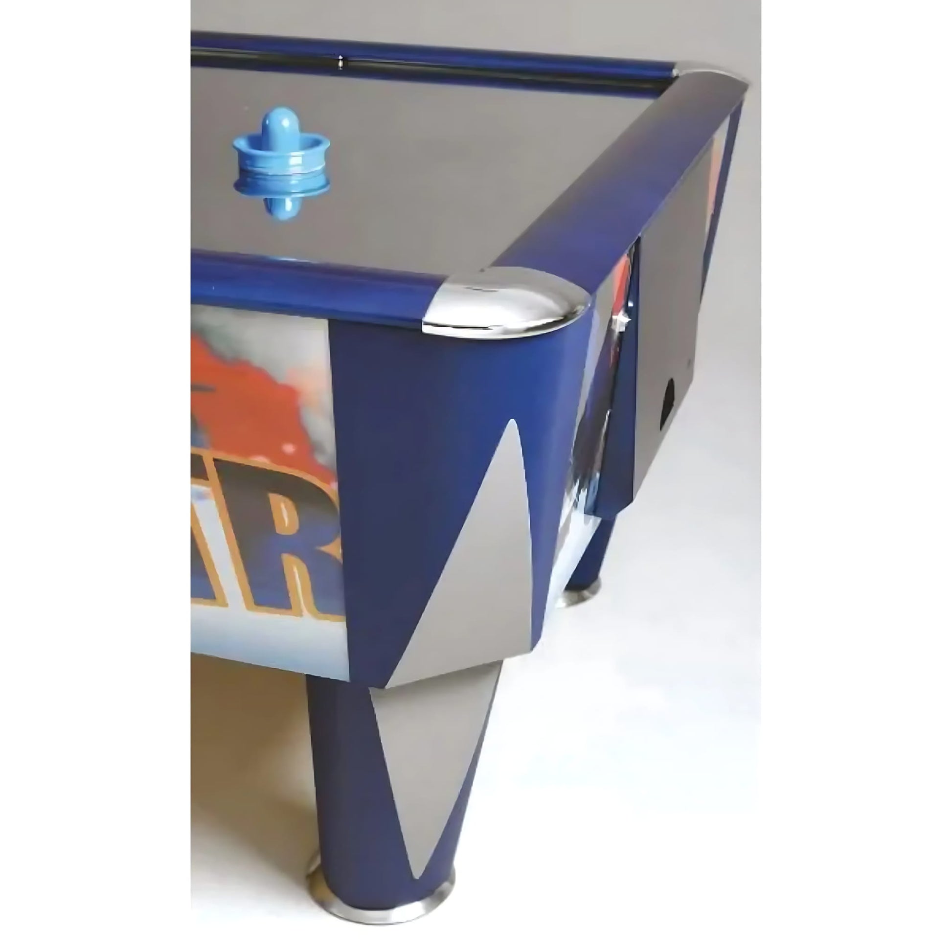 Close-up of a blue and white air hockey table with a blue puck on a white background