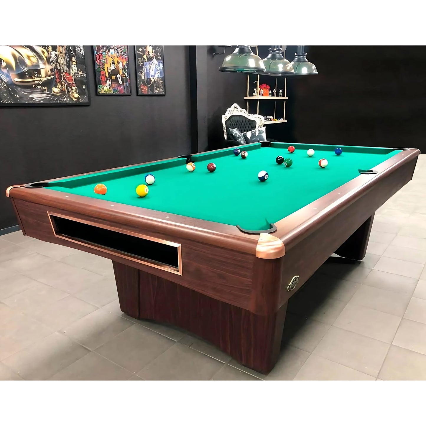 Pool table with green felt and brown frame in a room with dark walls and light-colored floor.